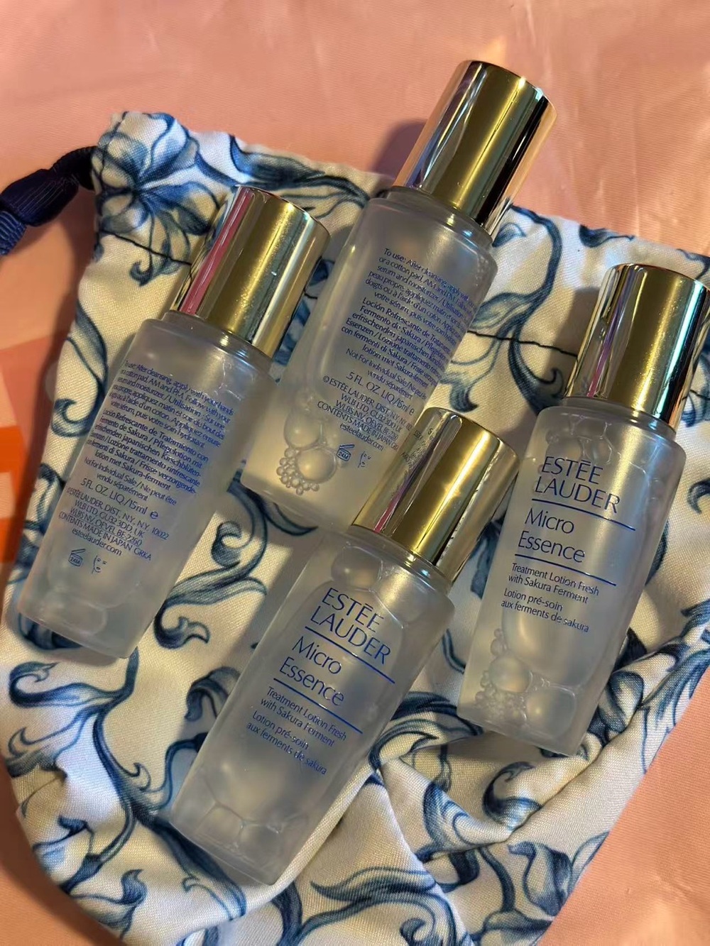 Estee Lauder Micro Essence Bottles with Gold Caps — Clear